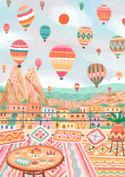 Pastel hot air balloons floating over a colorful hillside cityscape with bohemian patterns