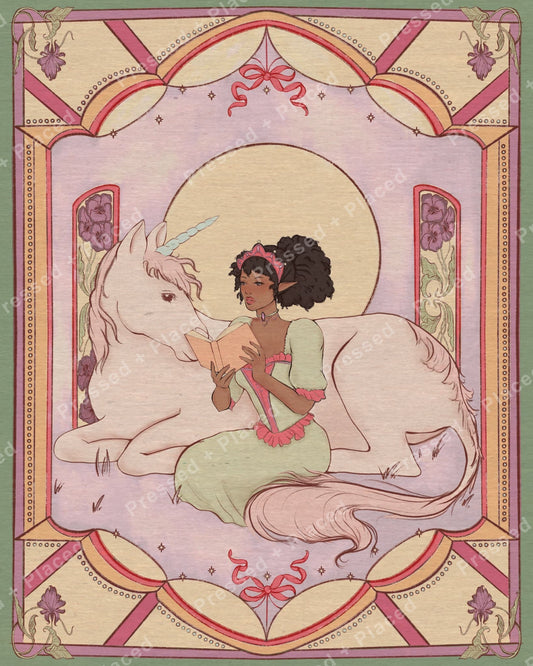 Fairy girl reading beside a white unicorn in a pastel ornate fantasy frame