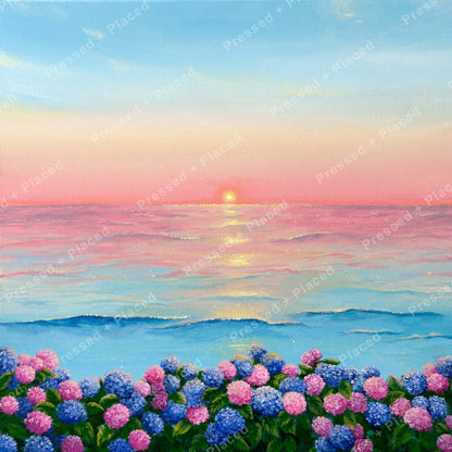 Pastel sunrise seascape with hydrangea flowers in pink and blue along the shore