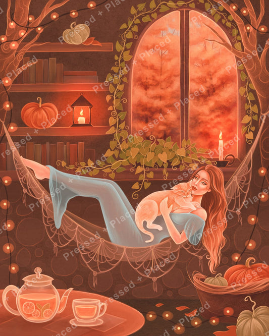 Woman lounging with cat in a cozy autumn room with candles, pumpkins, and warm glowing light